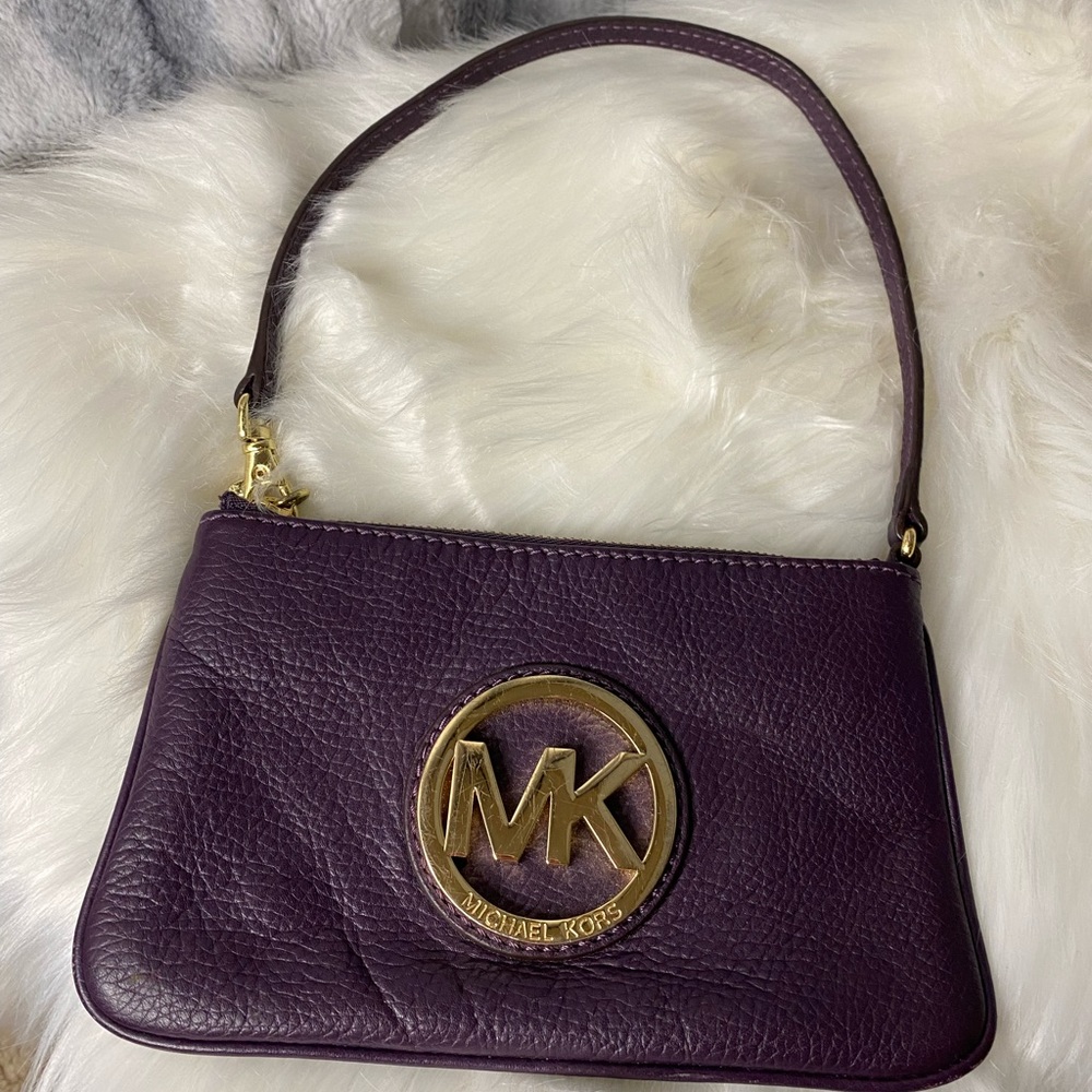 Purple Michael Kors small purse.